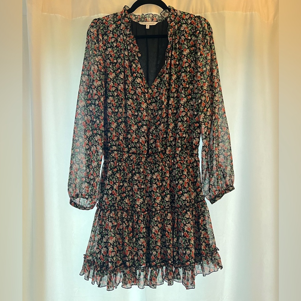 Black background with floral print. Perfect condition.
